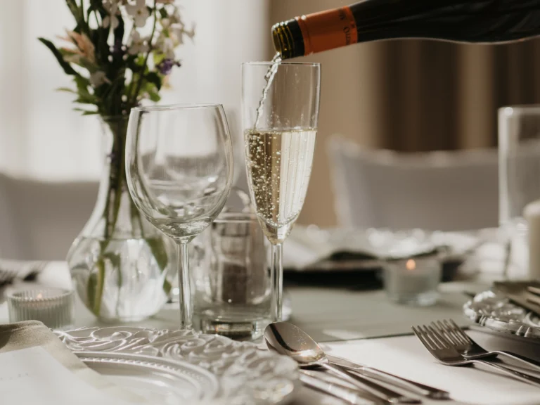 Pouring sparkling wine at a wedding